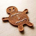 Gingerbread Person Coaster — the finished object this pattern is designed to produce