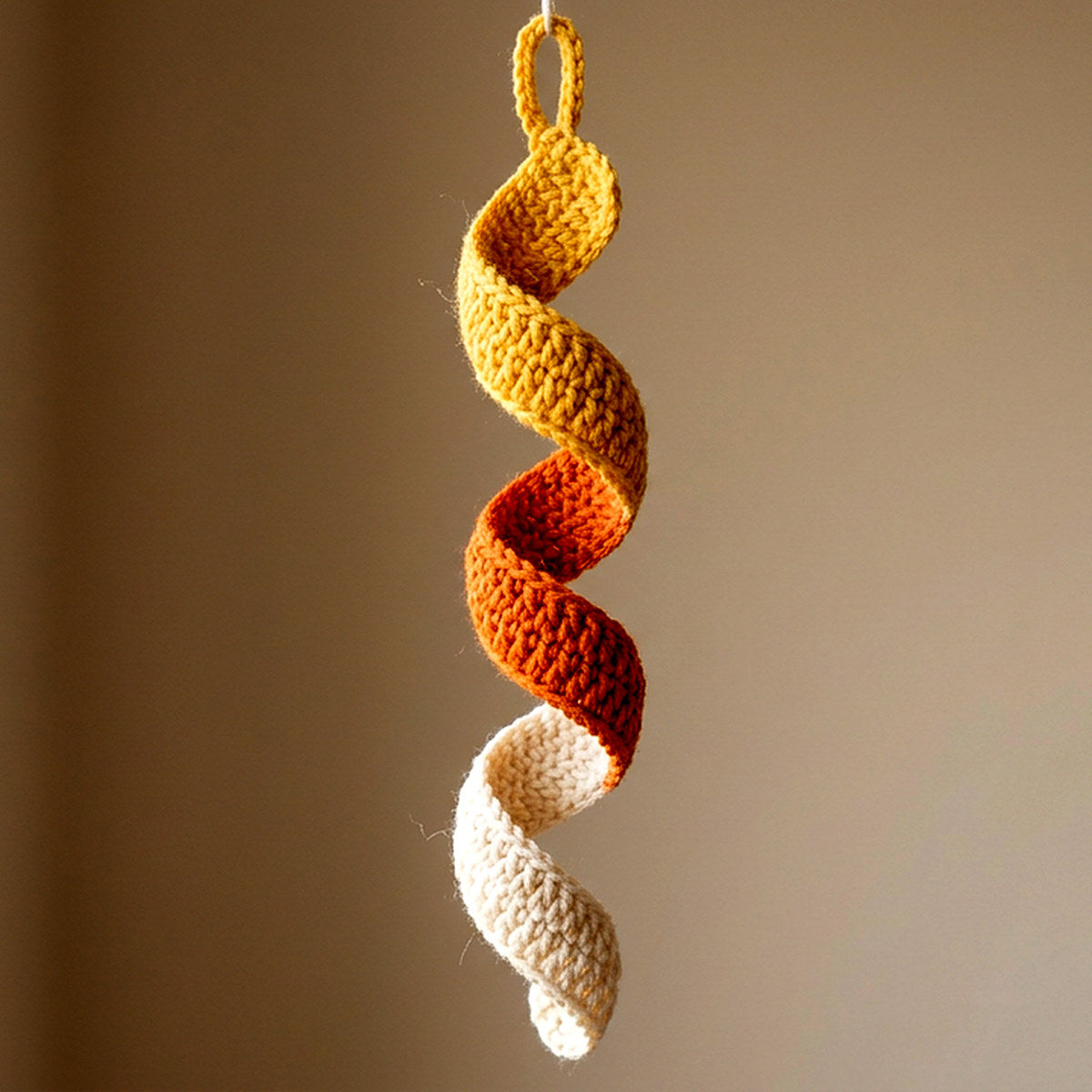 Candy Corn Spiral Ornament — the finished object this pattern is designed to produce
